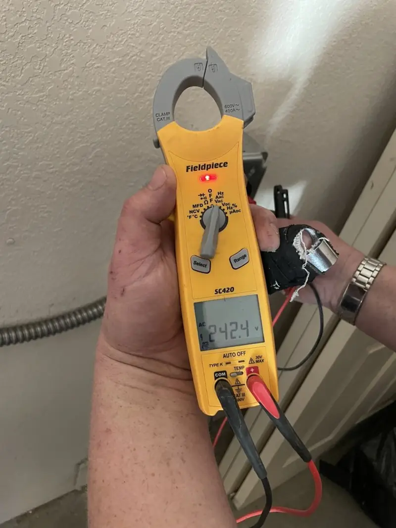 Voltage testing with clamp meter during Outlet Installation in Waverly
